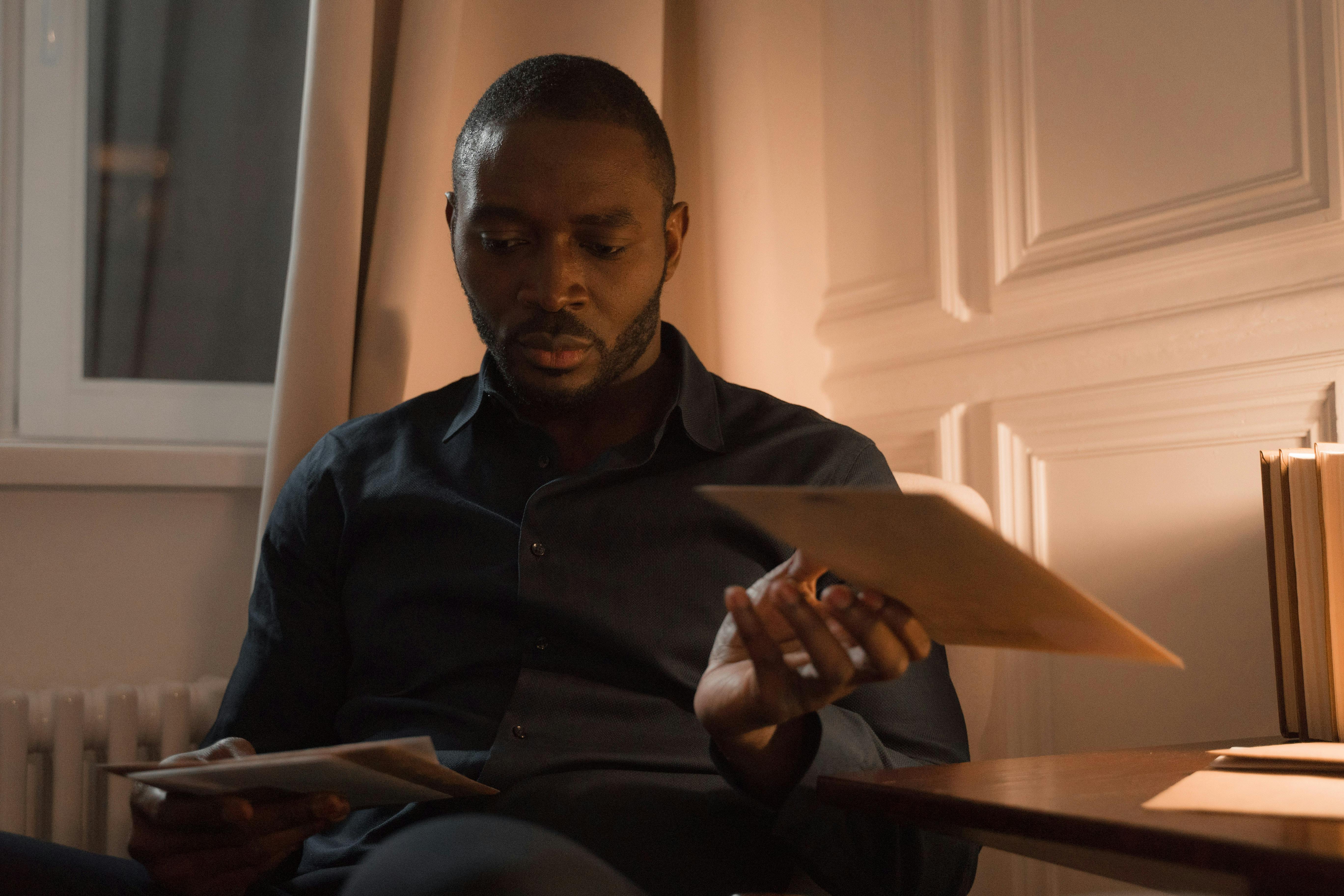 Man Reading Letter