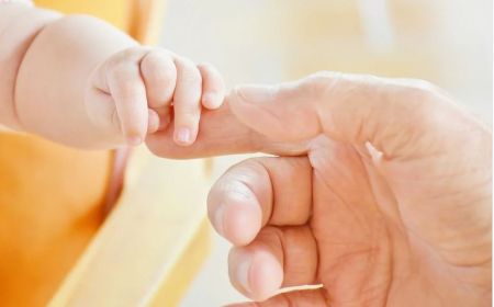 infant grasping finger