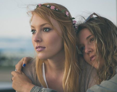 two girls staring at sunset