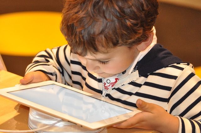 kid on tablet