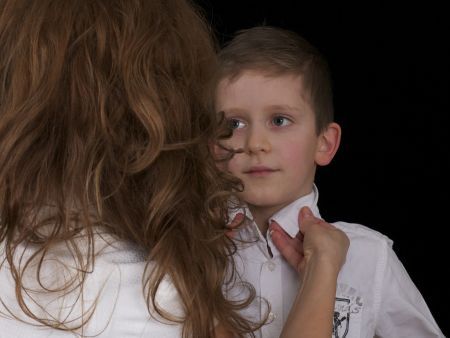 mother helping son