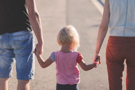 parents and kid walking away