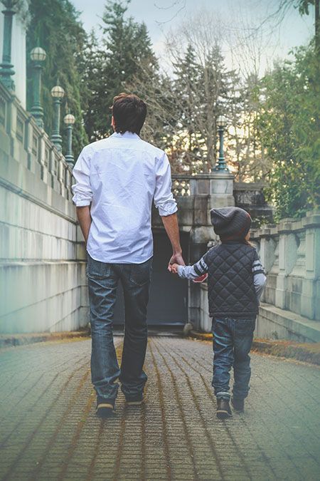 man and child walking