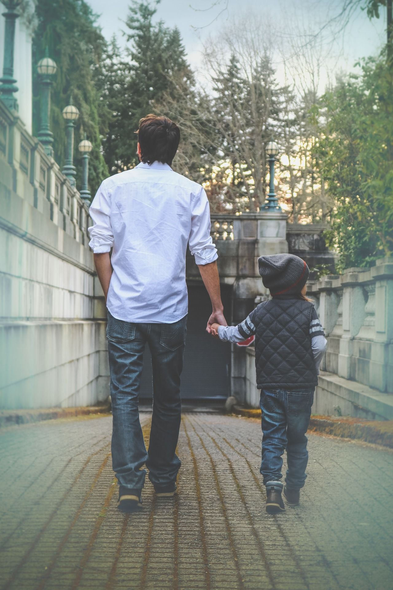 man and child walking