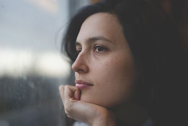 girl staring out window